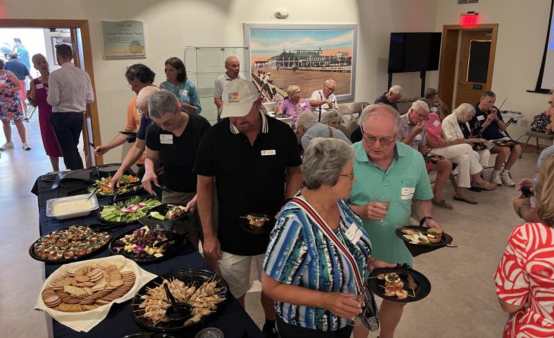 Guests at the opening reception for the Golden Age of Rehoboth diorama exhibition at the Rehoboth Beach Museum enjoy hors d’oeuvres from Above the Dunes.
